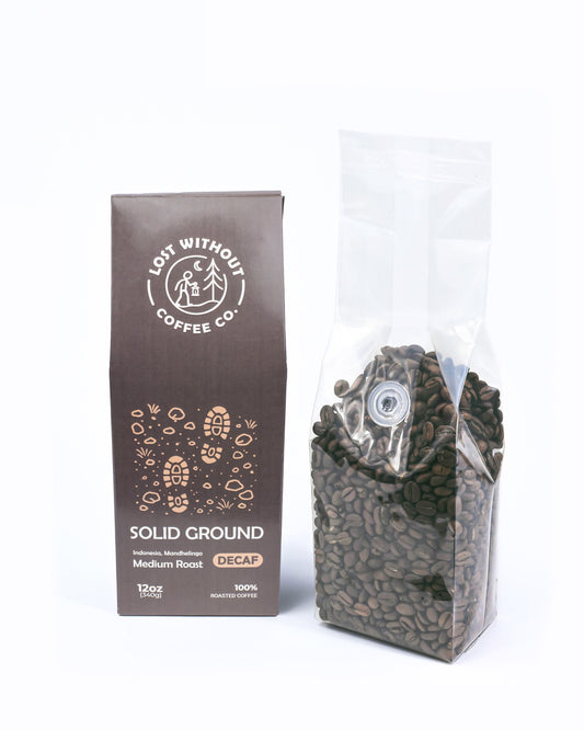 Fresh Roasted Decaf Coffee in a 12oz bag from Solid Ground featuring medium roast beans.