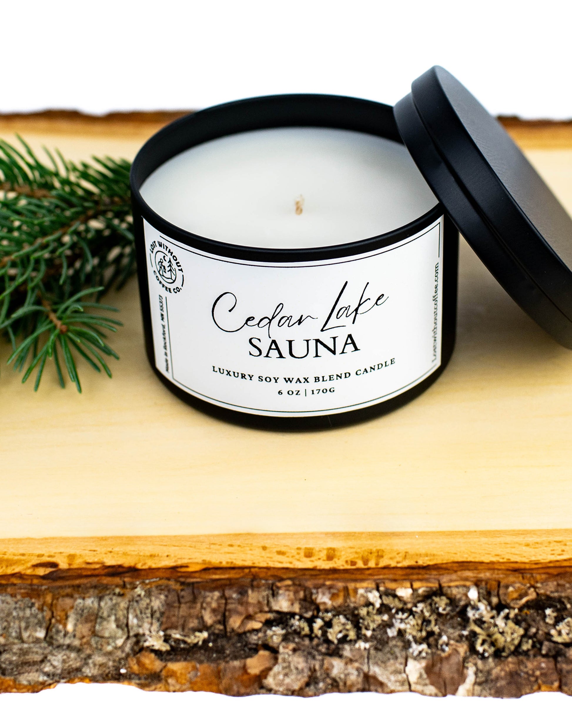 Soy Wax Candles Cedar Lake Sauna 6oz luxury scented candle on wooden surface with pine.