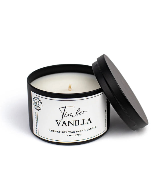 Soy Wax Candles in black jar labeled Timber Vanilla, 6oz luxury blend candle with cozy wood scent.