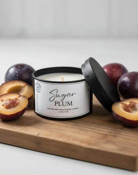 Candle with 'Sugar Plum' label on a white background with sugar on the board