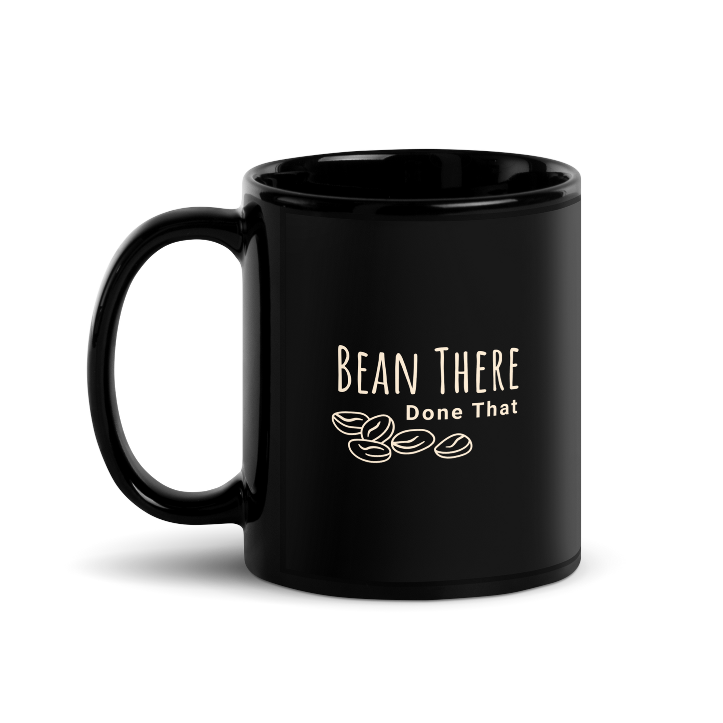 Black ceramic coffee mug featuring the phrase 'Bean There Done That' with coffee bean graphic.