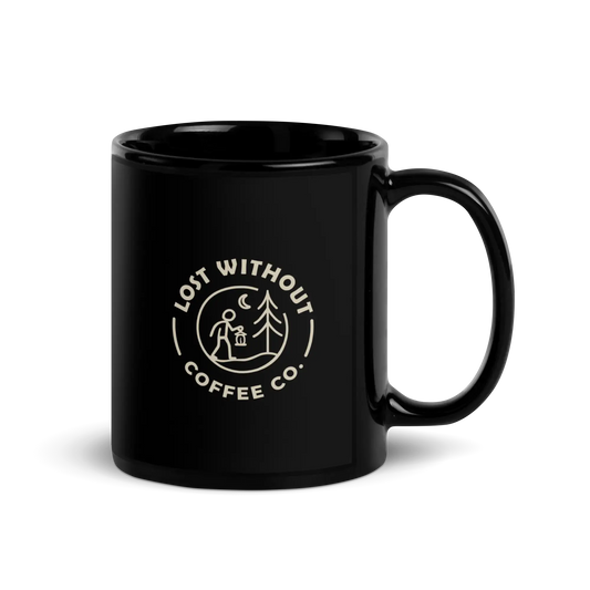 Black glossy coffee mug with "Lost Without Coffee Co." logo, ideal for coffee lovers and outdoor enthusiasts.